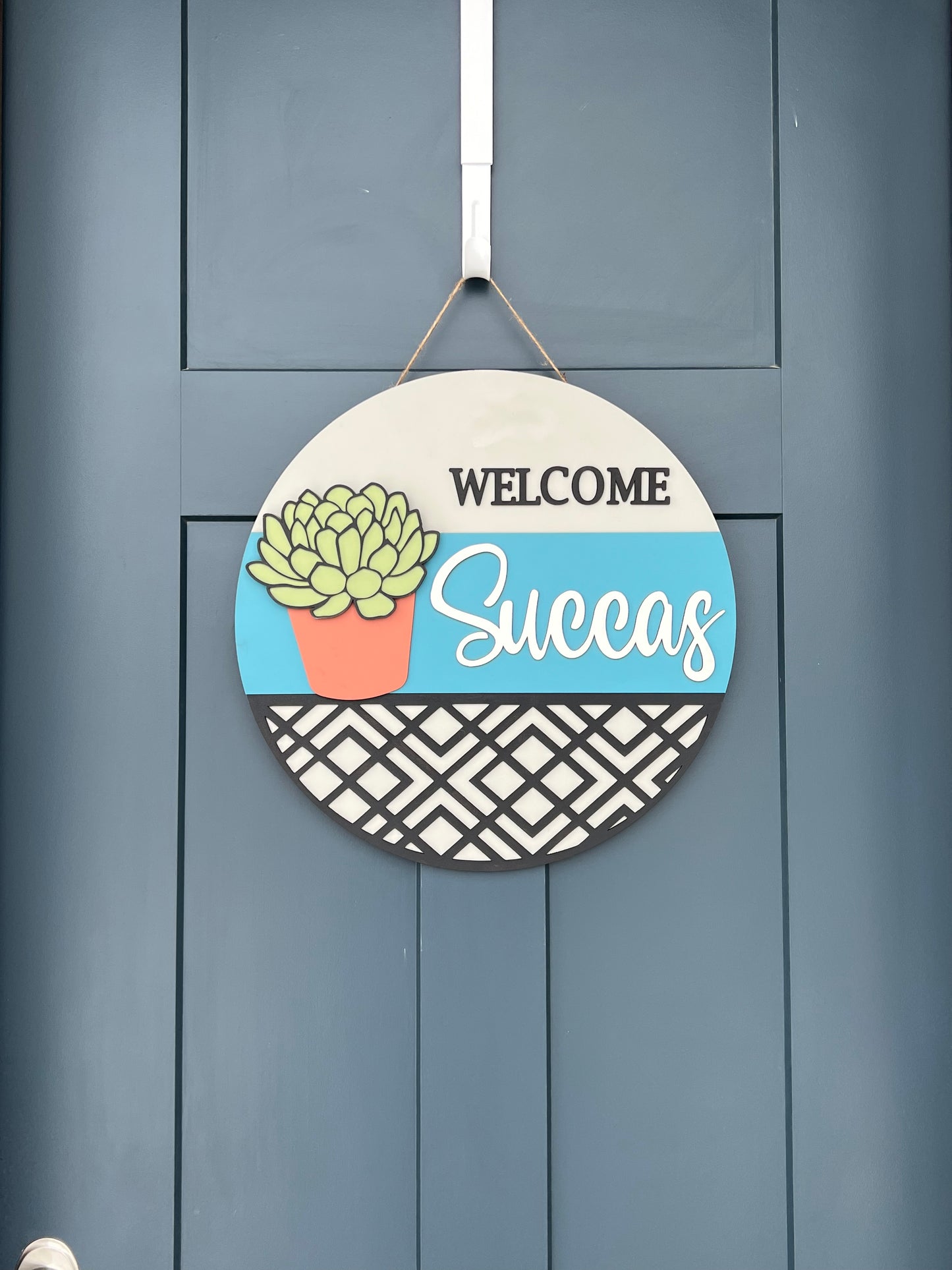 "Welcome Succas" Round Sign