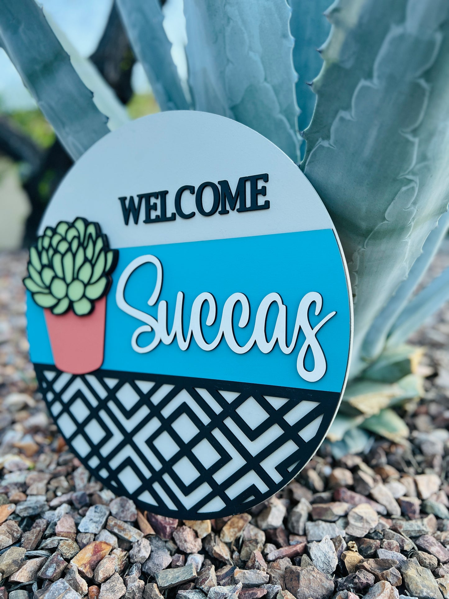 "Welcome Succas" Round Sign